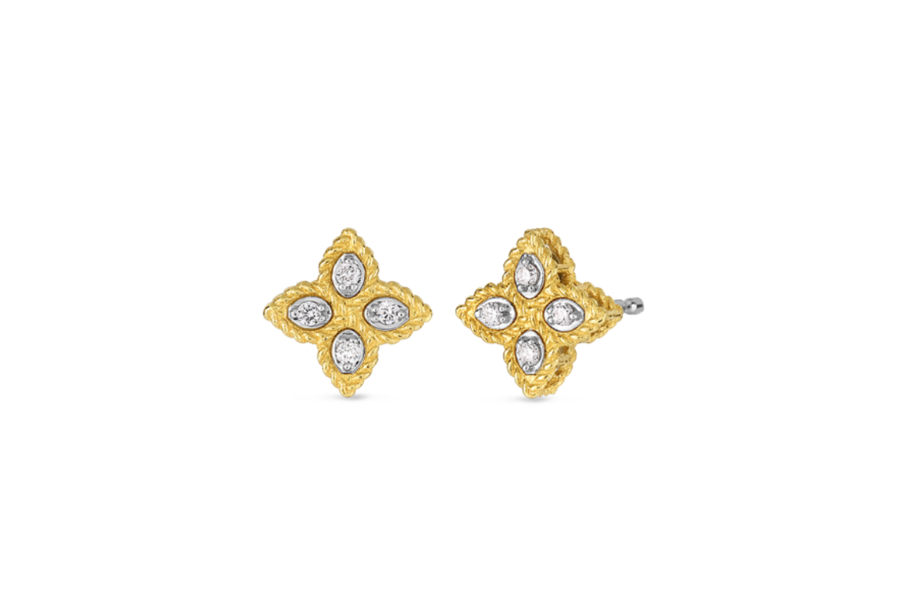 Golden clover-shaped earrings with diamonds in each of the clover sections.